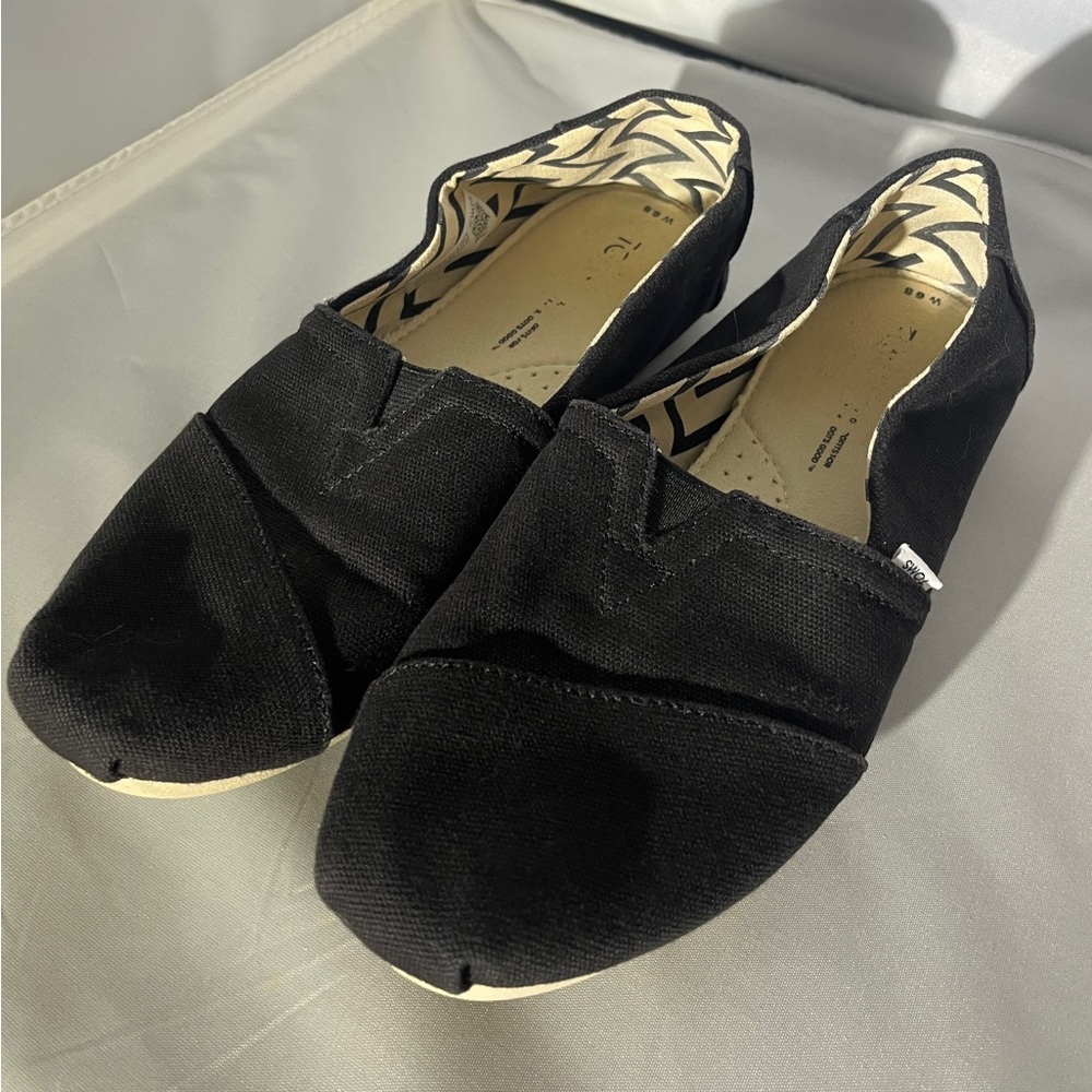 Toms Women’s Black Canvas Slip-Ons